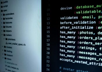 Developers monitoring code with warning signs for malicious Axios packages in a foggy environment.