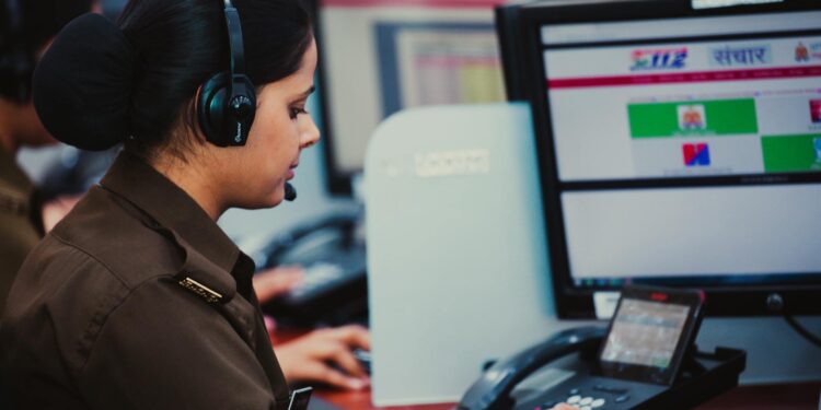 Law enforcement agents at a computer, disrupting a phishing operation linked to Tycoon 2FA.