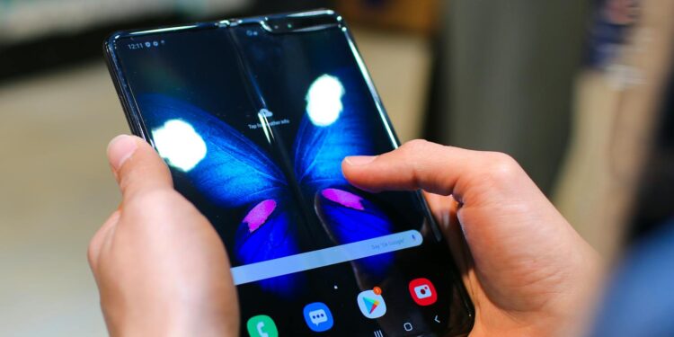 A smartphone displays Horizon Worlds, highlighting Meta's mobile focus.