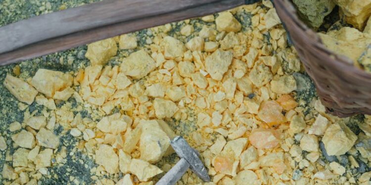 Cryptocurrency miners working on Zcash mining equipment in a modern facility.