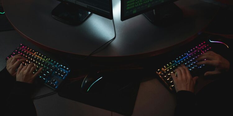 A computer screen displays code with security symbols, highlighting AI in cybersecurity.