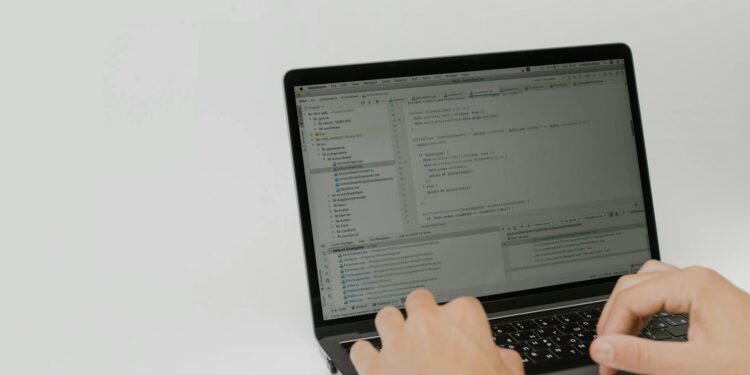 A developer using OpenAI's new Superapp interface on a laptop, showcasing its features.