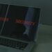 A close-up of a computer screen displaying malware alerts in a gaming chat.