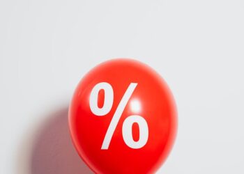 Graph showing Bitcoin price surge alongside Federal Reserve interest rate cut signals.