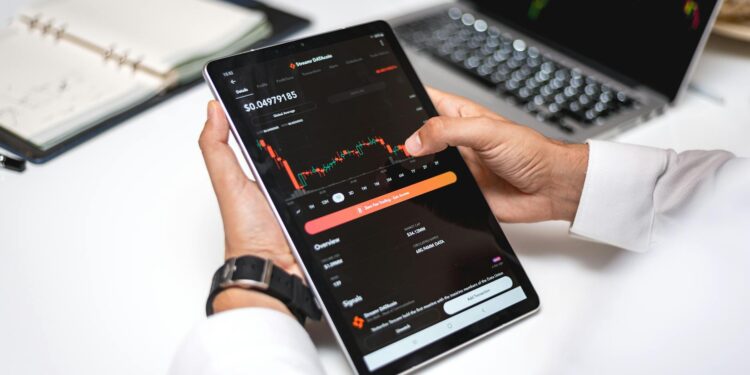 A financial advisor reviews cryptocurrency regulations on a digital tablet.