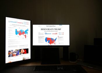 Candidates celebrating victory with supporters at a congressional primary election event.