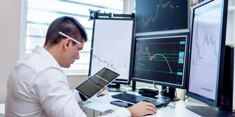 Traders anxiously monitor stock market screens as KOSPI index crashes in South Korea.