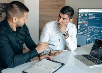 A financial analyst discusses Bitcoin treasury strategies at a conference.