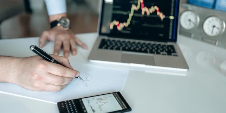 Changpeng Zhao speaking at a conference, surrounded by cryptocurrency graphics and charts.