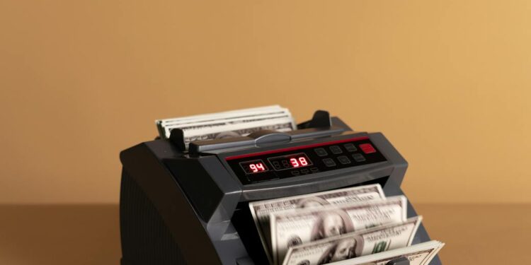 Two bank employees discussing digital currency operations at a financial institution.