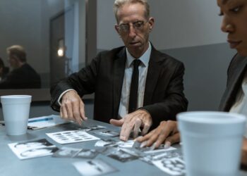 A diverse team of law enforcement agents discusses strategies against cryptocurrency fraud.