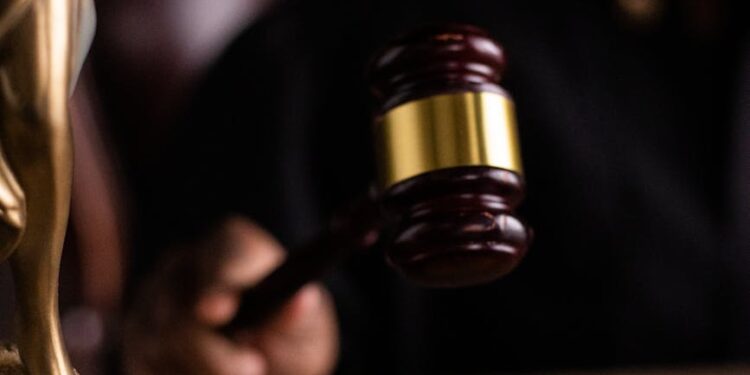 A judge's gavel with Bitcoin symbols, symbolizing a legal dispute over cryptocurrency.