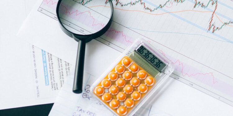 Institutional investors examining Staked Ethereum ETF financial documents and charts.