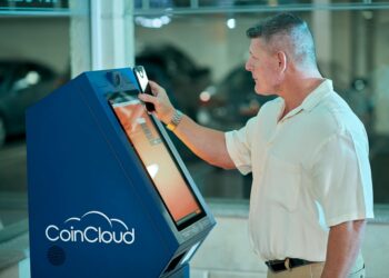 A digital payment terminal showcasing crypto options for tourists in South Korea.