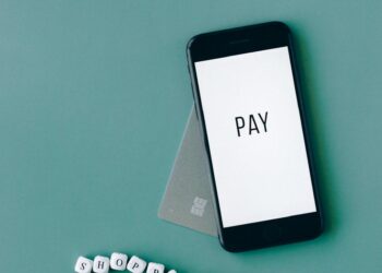 A digital wallet displaying stablecoin transactions on a smartphone screen.