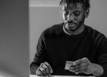 Forensic investigator analyzing digital data on cryptocurrency theft case.