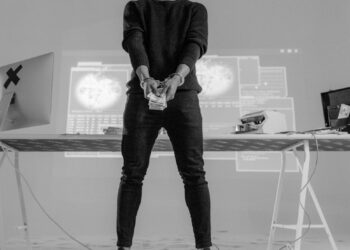 FBI agents apprehend John Daghita in connection with a cryptocurrency theft investigation.