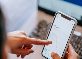 Traders analyzing stock charts with Nasdaq logo, symbolizing finance innovation and prediction markets.