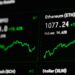 Financial graphs showing declining trends for Bitcoin and Ethereum prices.