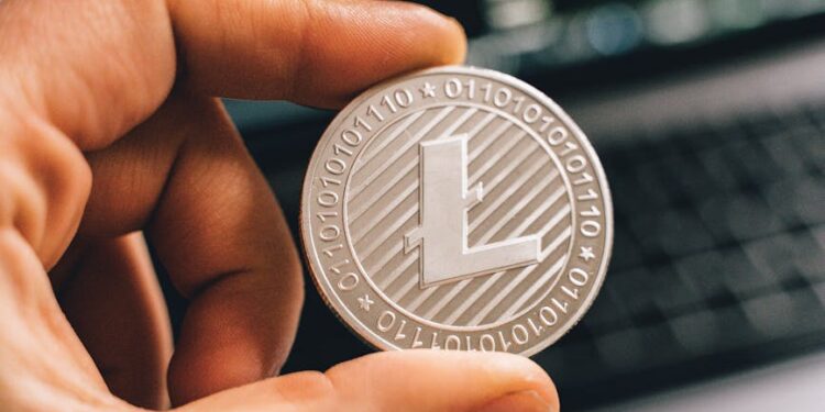 A close-up of a digital currency symbol overlaying a blurred financial market background.