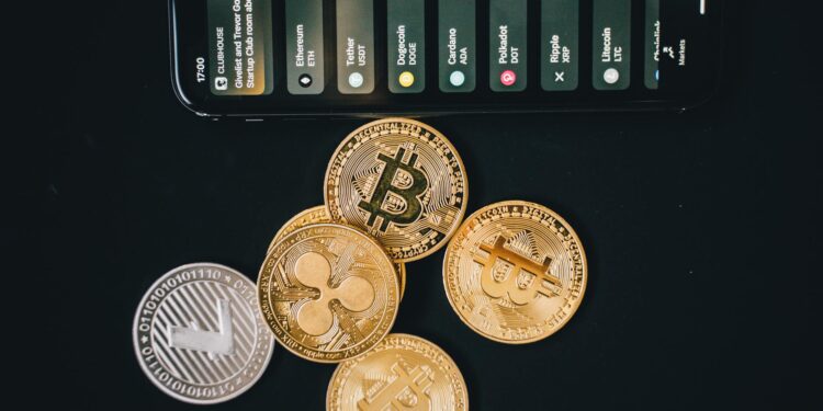 A smartphone displaying a Bitcoin wallet with the New York skyline in the background.