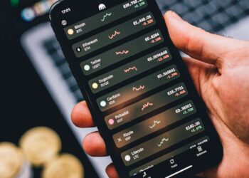 A portrait of a designer working on cryptocurrency concepts for a financial app.