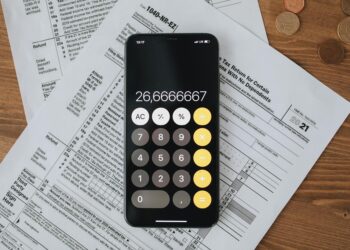 A person reviews digital cryptocurrency tax forms on a laptop screen.