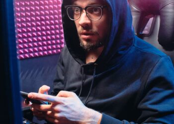 A cybersecurity team monitors screens displaying phishing schemes targeting crypto approvals.