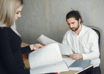 Employees at OP Labs reviewing Ethereum Layer-2 development plans in a modern office setting.