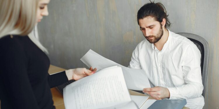 Employees at OP Labs reviewing Ethereum Layer-2 development plans in a modern office setting.