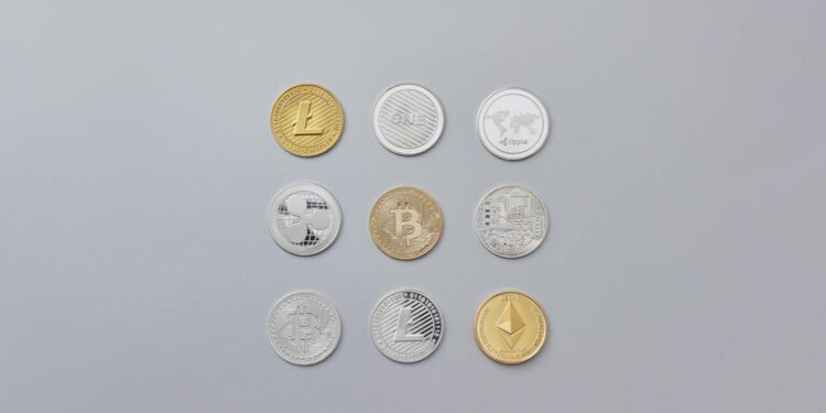 Bitcoin coins arranged on a table with a digital wallet interface displayed in the background.