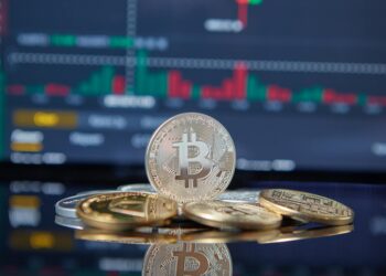 A Bitcoin chart showing values hovering near $68,000, with market indicators displayed.