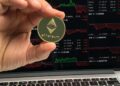 Ethereum coins stacked with a chart showing rising cryptocurrency prices.
