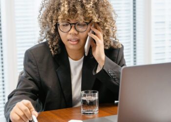 Bank of Japan officials discuss blockchain technology in a modern conference room.