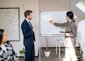 New CFO at Ledger with team members discussing growth strategies in a modern office setting.