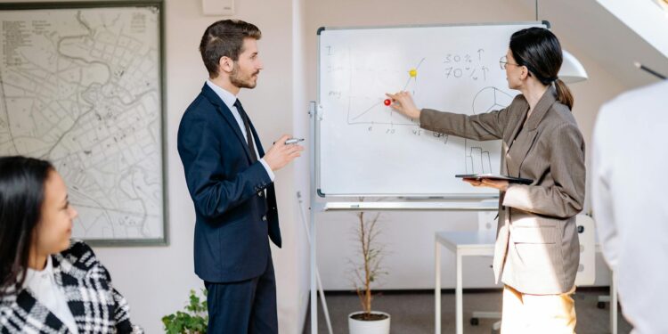 New CFO at Ledger with team members discussing growth strategies in a modern office setting.