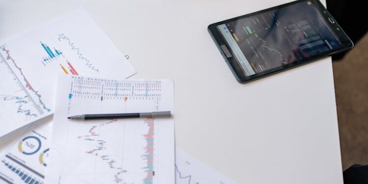 Senators discussing stablecoin regulation with financial charts and documents on a table.
