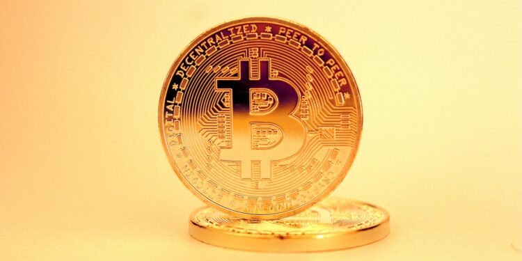 Cryptocurrency coins and a broken chain symbolizing illicit financial transactions.