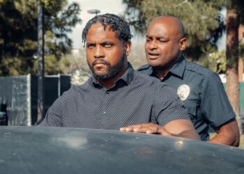 A police badge and crypto coins representing theft and financial crime.