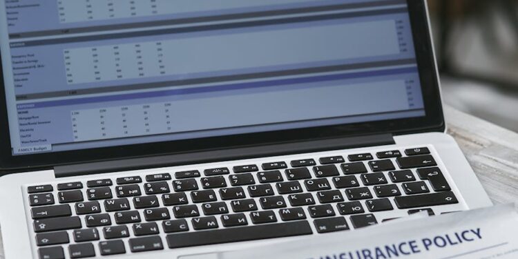 Blockchain technology displayed on a digital screen alongside financial charts and documents.