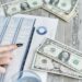 A distressed retiree looks at financial documents amid cryptocurrency symbols and dollar signs.