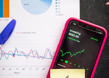 Graph showing Ripple's stock performance with a dollar sign and upward trend arrows.