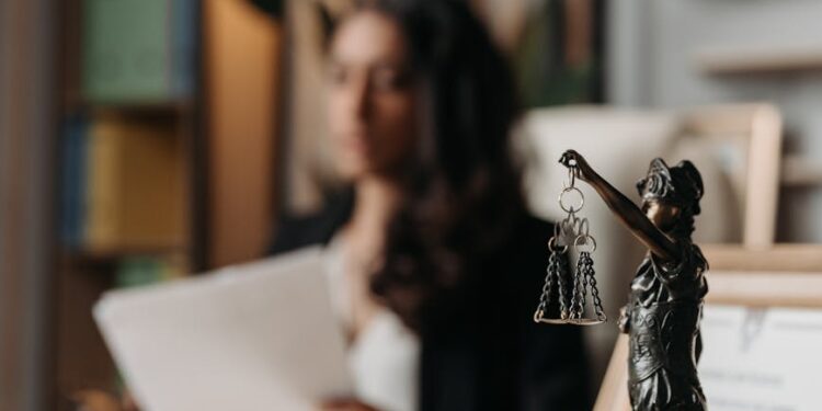 JPMorgan logo overlaid on a blurred background of cryptocurrency graphics and legal documents.