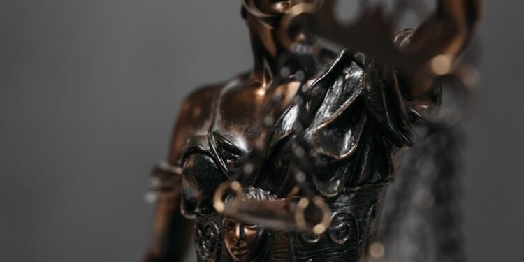 USDT cryptocurrency coins with a gavel and scales, symbolizing legal action in a scam case.