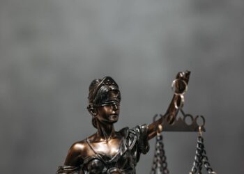 A lawyer standing in a courthouse discussing a lawsuit about a prediction market.