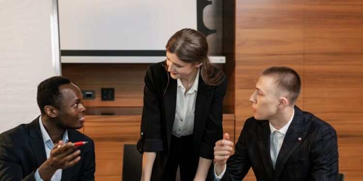 Group of people in suits discussing cryptocurrency regulations in a conference room.