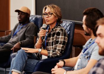 Charles Hoskinson speaks at a conference, discussing crypto investments and Midnight's launch.