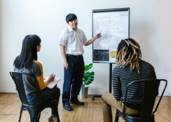 Traders monitor crypto charts as Bitcoin options expiration causes market fluctuations.