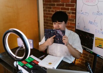 A South Korean official presents a digital display on crypto tax enforcement using AI technology.