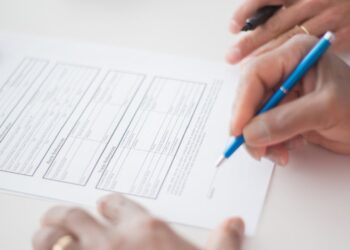 Tech executives sign energy pledge document, highlighting commitment to sustainability amid tensions.